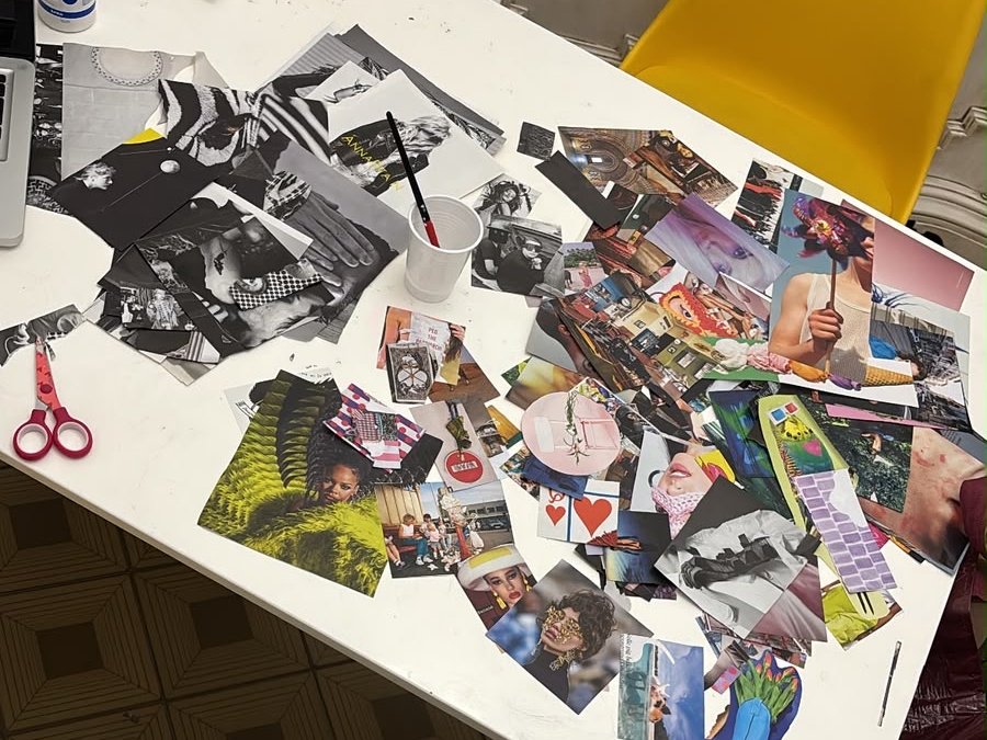 Ritagli, forbici e collage in lavorazione sul tavolo di exhplosion